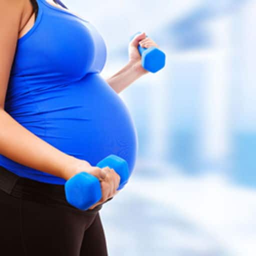 image of lady doing pregnancy exercises lifting a pair of dumbells